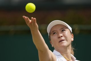 Ex-Suissesse, Lulu Sun jouera les 8es de finale à Wimbledon KEYSTONE/AP/Mosa'ab Elshamy